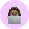 a memoji of a girl working on a laptop